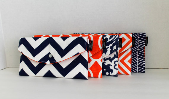Orange and Navy Mismatched Clutches - pick a purse each bridesmaid will love in a particular color with her own unique pattern or print.