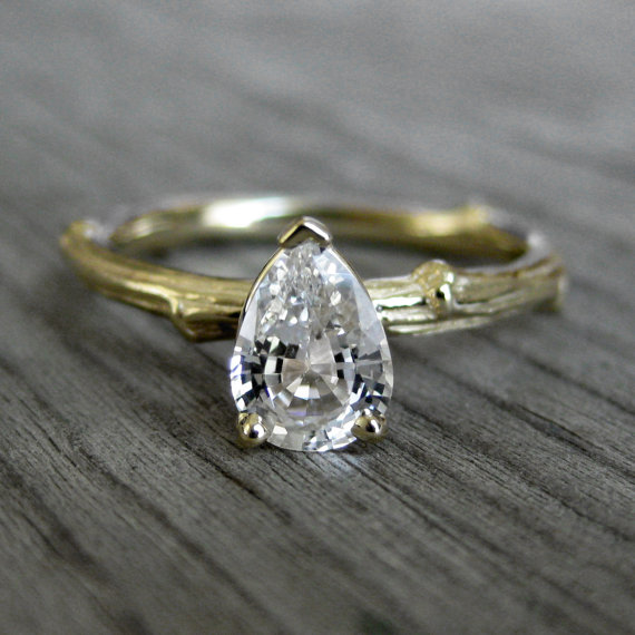 pear shaped sapphire engagement ring with twig band