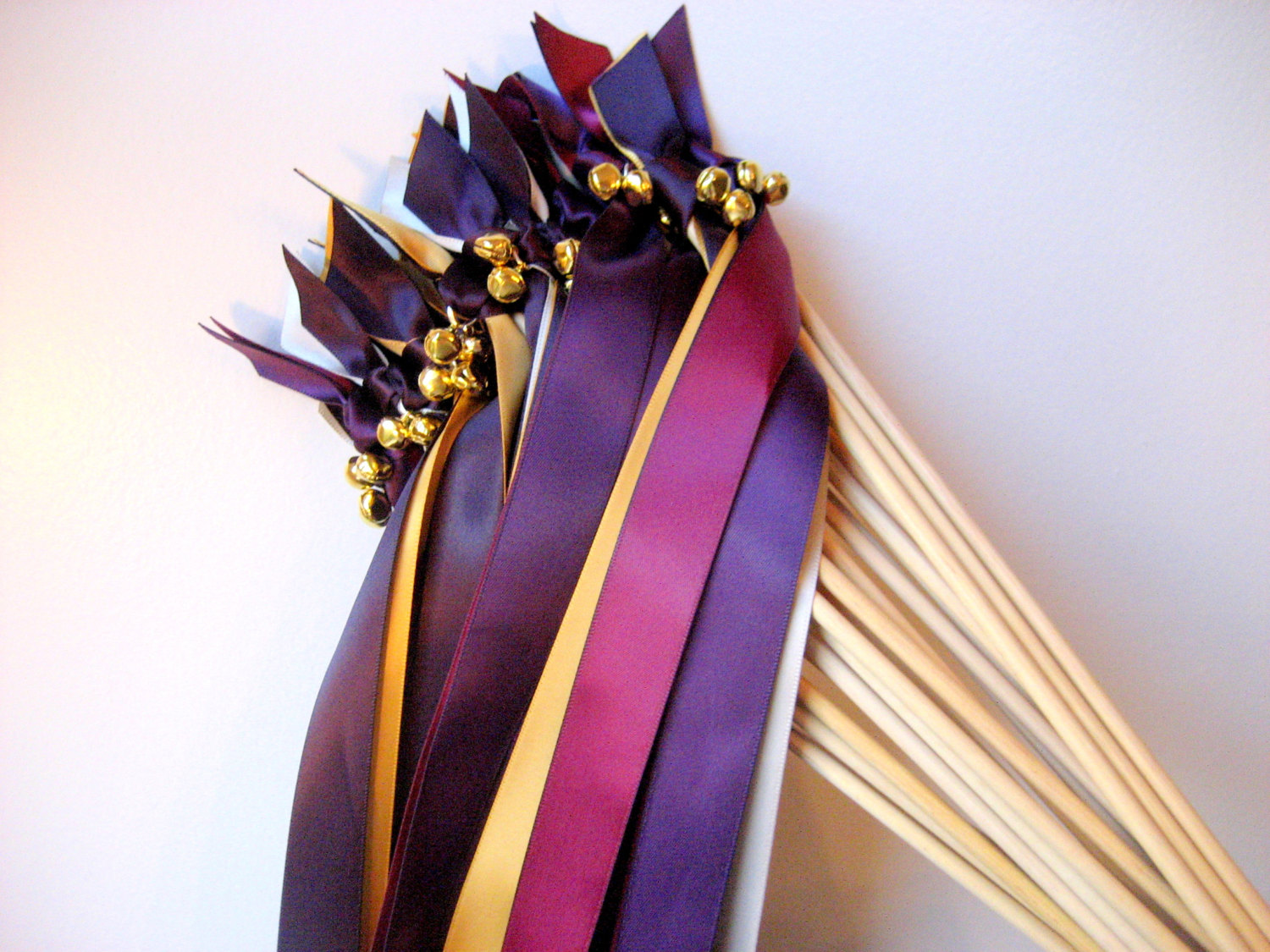 pink and purple ribbon wands with bells
