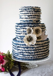 ruffled blue wedding cake with anemone flowers
