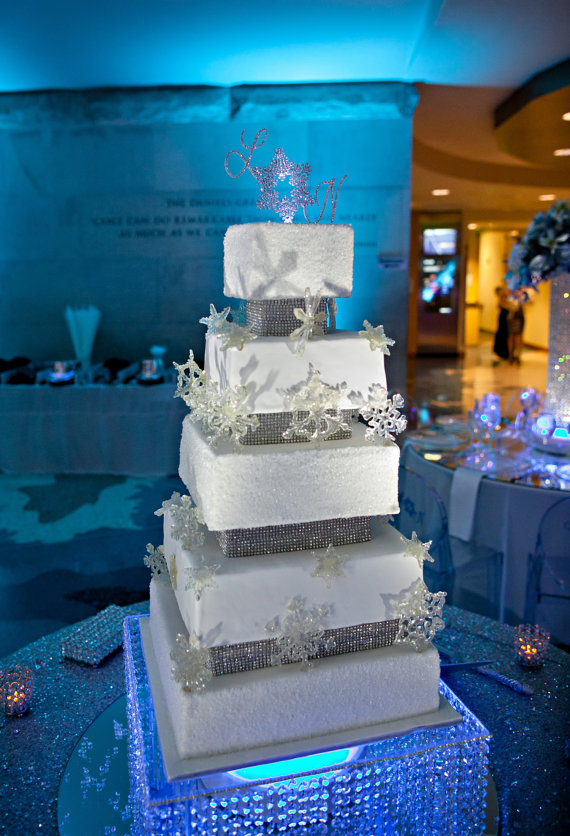 sparkly winter wedding cake with rhinestone cake topper