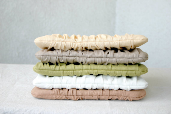 stack of pleated clutch purses