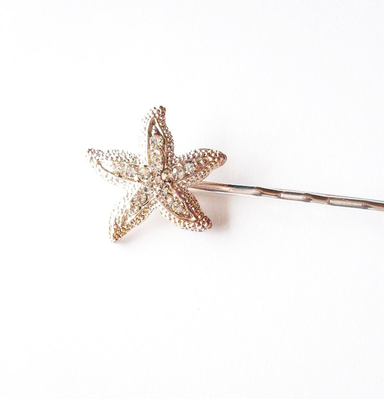 starfish bobby pin for the flower girl | via starfish wedding ideas: https://emmalinebride.com/beach/starfish-wedding-ideas/