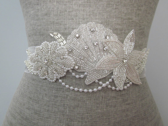starfish wedding dress sash | via starfish wedding ideas: https://emmalinebride.com/beach/starfish-wedding-ideas/