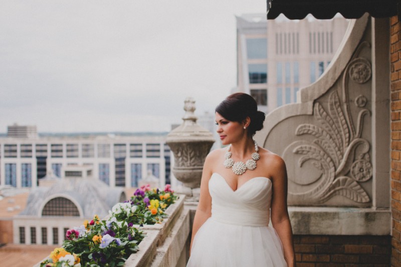 statement necklace worn by bride with sweetheart strapless gown