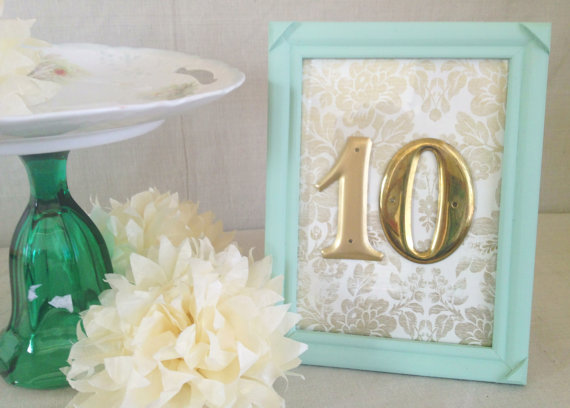 Gold Table Numbers with Light Blue Frame (by River Kiss Weddings via Emmaline Bride)