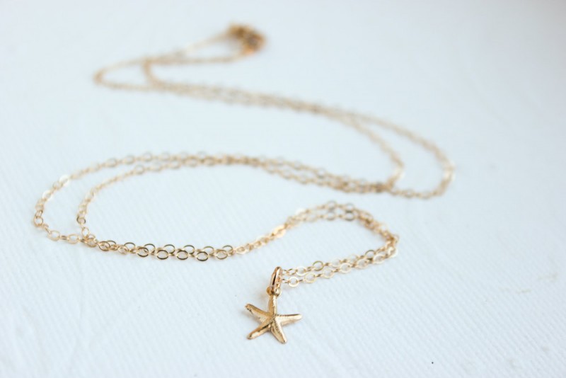 teeny starfish necklace | via starfish wedding ideas: https://emmalinebride.com/beach/starfish-wedding-ideas/