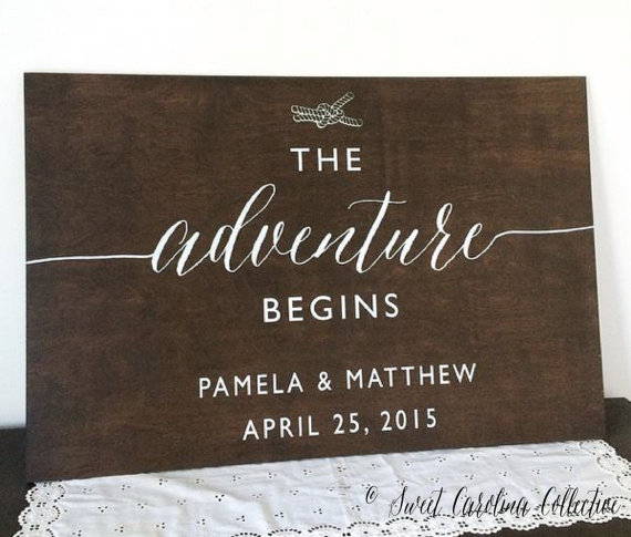 the adventure begins nautical welcome wedding sign by sweetnccollective
