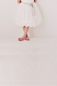 up close of flower girl dress with lace to show scallop lace detail
