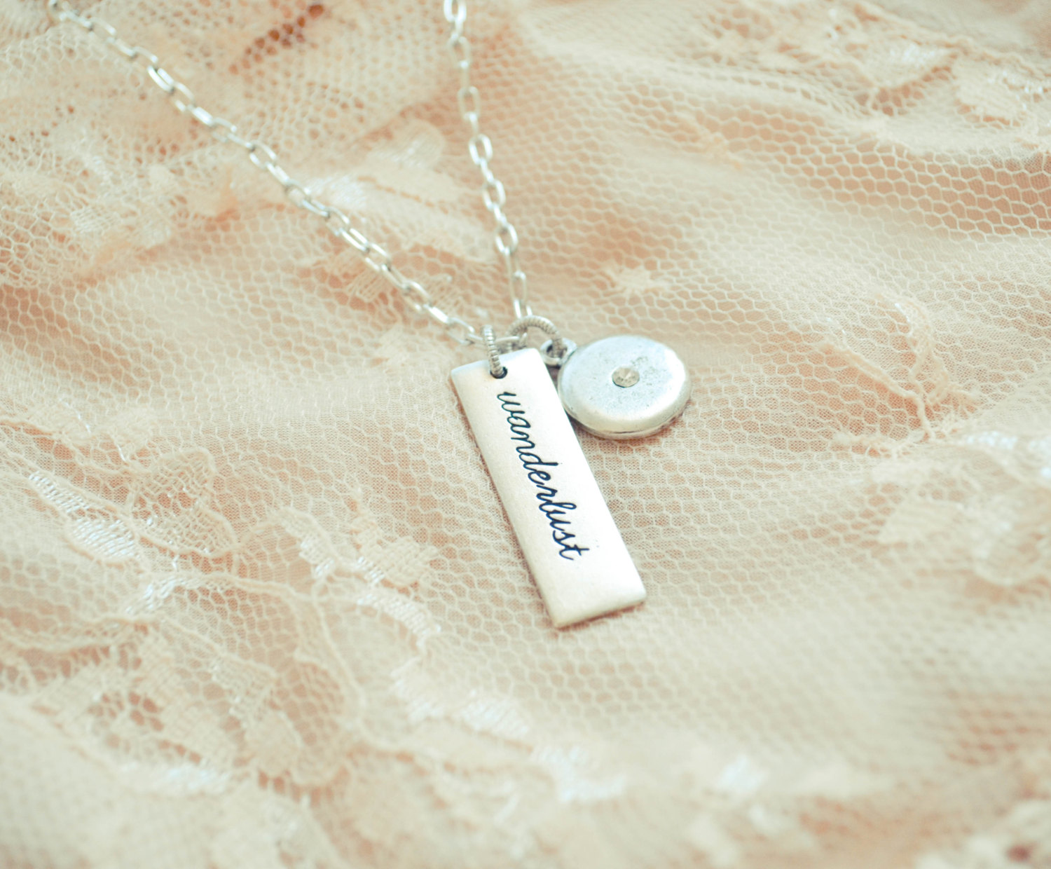 wanderlust necklace with heart | gifts bridesmaids travel | https://emmalinebride.com/gifts/gifts-bridesmaids-travel