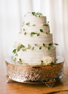 wedding cake accented with leaves