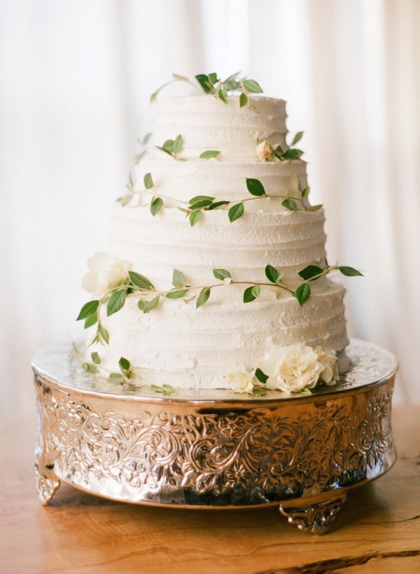 wedding cake accented with leaves