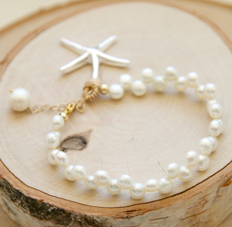 pearl starfish bracelet for the beach bride | via starfish wedding ideas: https://emmalinebride.com/beach/starfish-wedding-ideas/