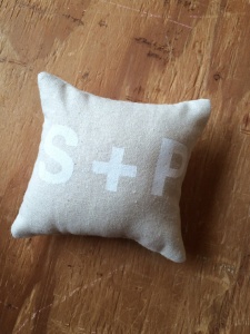 white text ring bearer pillow with initials