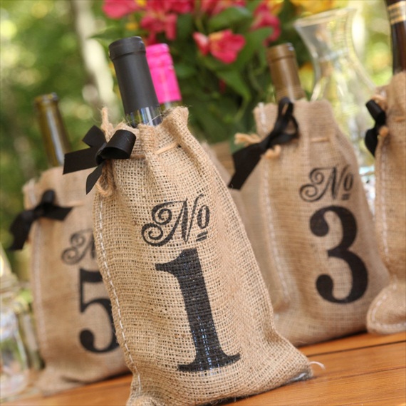 wine bottle table number bags made of burlap - wine themed wedding ideas